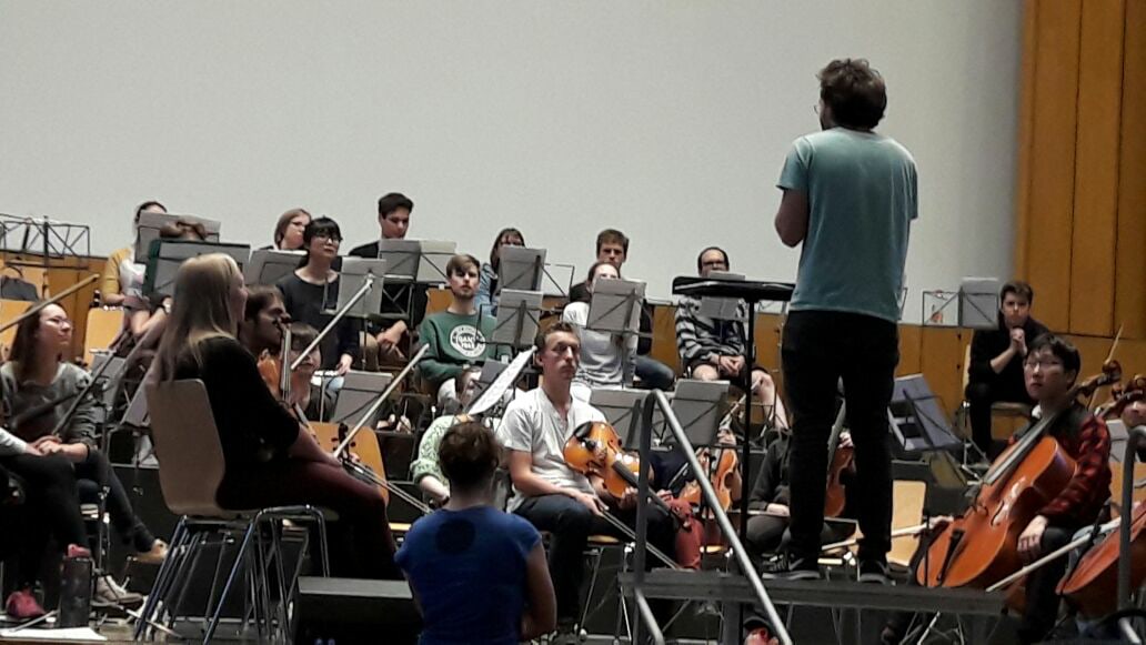 Conducting or composing work